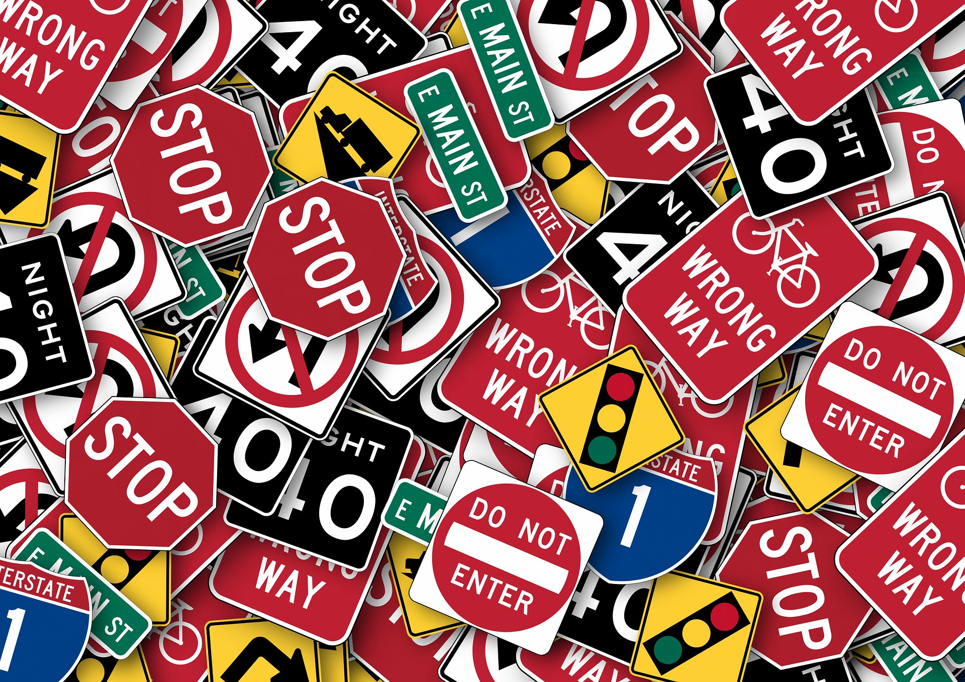 Many traffic signs piled onto each other